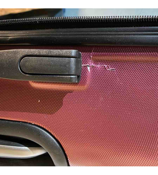 réparation de coque fendue de bagage